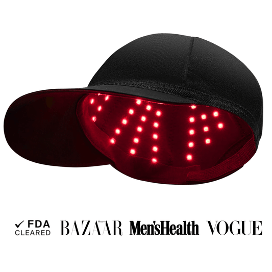 Black cap with red LED lights on a white background, featuring logos of BAZAAR, Men's Health, and Vogue.